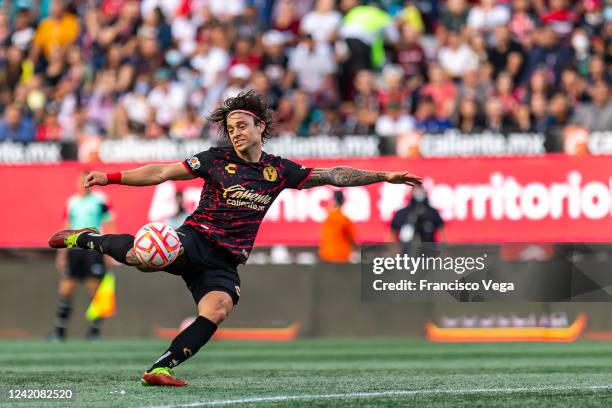 Joaquin Montecinos of Tijuana kicks the ball during the 4th round match between Tijuana and America as part of the Torneo Apertura 2022 Liga MX at...