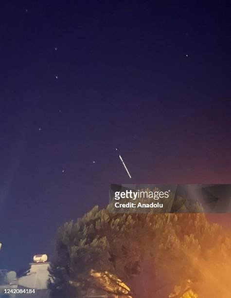 Single line of light beams belonging to Elon Musk's Starlink satellites launched by SpaceX is seen in the sky in Antalya, Turkiye on July 24, 2022.