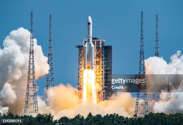 The rocket carrying Chinas second module for its Tiangong space station lifts off from Wenchang spaceport in southern China on July 24, 2022. - China...