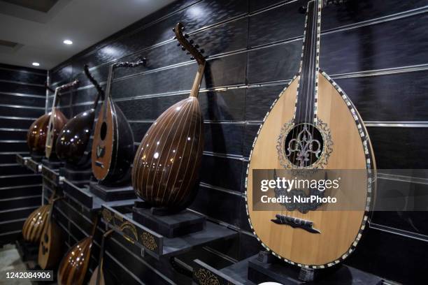 Veteran oud-maker at the al-Marg district on the outskirts of the Egyptian capital Cairo on JULY 23, 2022. - The oud, a centuries-old stringed...