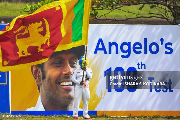 Sri Lankan cricket fan watches the game during the first day of the second cricket Test match between Sri Lanka and Pakistan at the Galle...