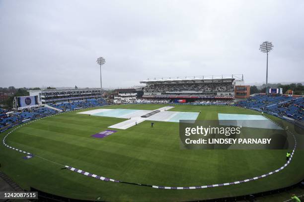 Covers are seen on the pitch as rain interrupted the third one-day international cricket match between England and South Africa at the Headingley...