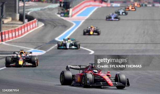 Ferrari's Monegasque driver Charles Leclerc leads ahead of Red Bull Racing's Dutch driver Max Verstappen during the French Formula One Grand Prix at...