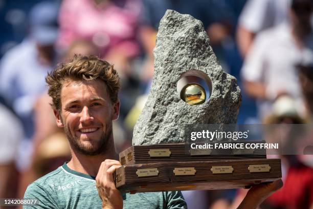 Norway's Casper Ruud raises the trophy after winning his final match against Italy's Matteo Berrettini at the Swiss Open tennis tournament in Gstaad,...