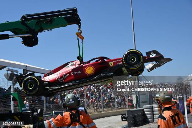The car of Ferrari's Monegasque driver Charles Leclerc is evacuated after he crashed during the French Formula One Grand Prix at the Circuit...