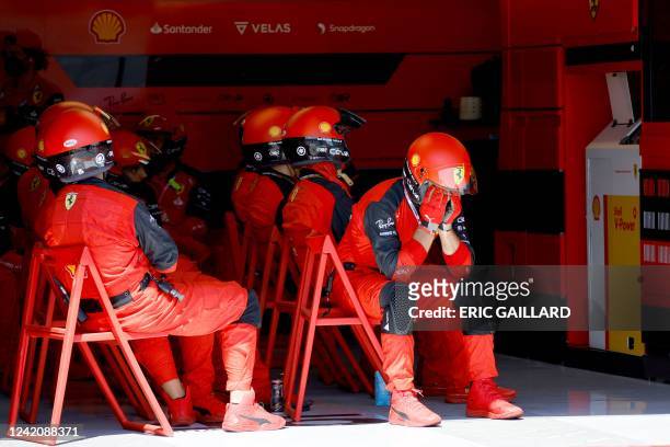 Ferrari mechanic reacts after Ferrari's Monegasque driver Charles Leclerc crashed during the French Formula One Grand Prix at the Circuit Paul-Ricard...