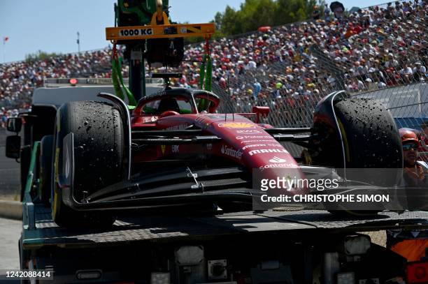 The car of Ferrari's Monegasque driver Charles Leclerc is evacuated after he crashed during the French Formula One Grand Prix at the Circuit...