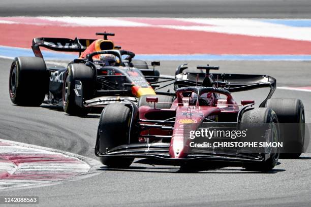 Ferrari's Monegasque driver Charles Leclerc races ahead Red Bull Racing's Dutch driver Max Verstappen during the French Formula One Grand Prix at the...