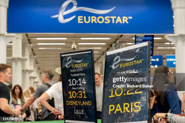 Eurostar passengers and holidaymakers queue to access French border controls on the British side at start of the summer holiday weekend which has led...
