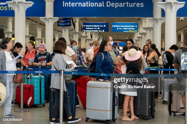 Eurostar passengers and holidaymakers queue to access French border controls on the British side at start of the summer holiday weekend which has led...