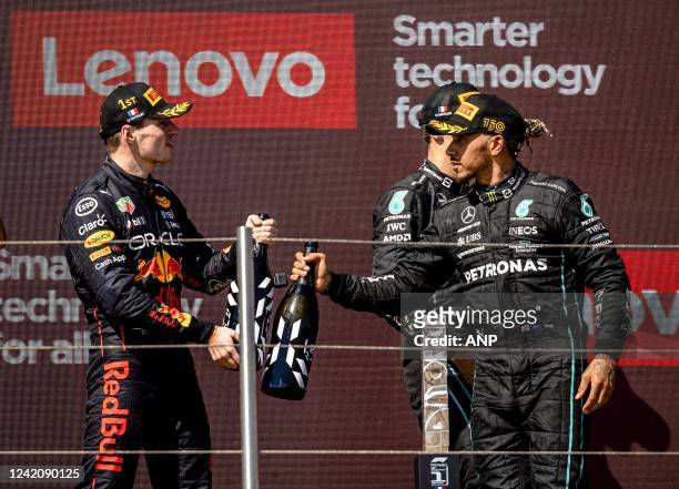 Max Verstappen and Lewis Hamilton on the podium after the F1 Grand Prix of France at Circuit Paul Ricard on July 24, 2022 in Le Castellet, France....