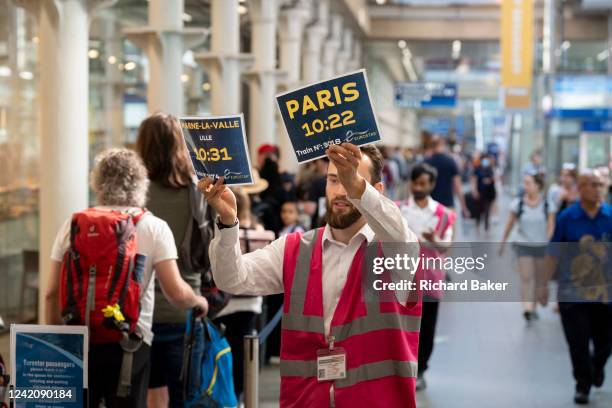 Eurostar passengers and holidaymakers queue to access French border controls on the British side at start of the summer holiday weekend which has led...