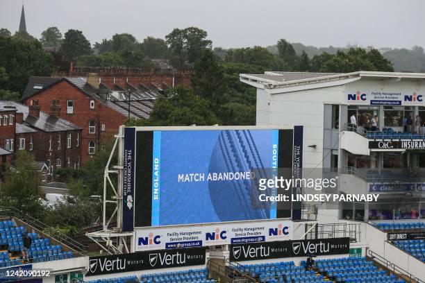 Giant screen warns of the calling off the third one-day international cricket match between England and South Africa at the Headingley cricket...