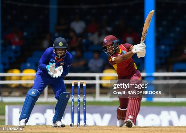 Shai Hope of West Indies hits 4 and Sanju Samson of India watch during the 2nd ODI match between West Indies and India at Queens Park Oval, Port of...