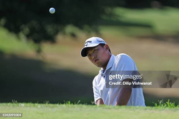 Kevin Yu chips on to the green on the first hole during the final round of the Price Cutter Charity Championship presented by Dr Pepper at Highland...