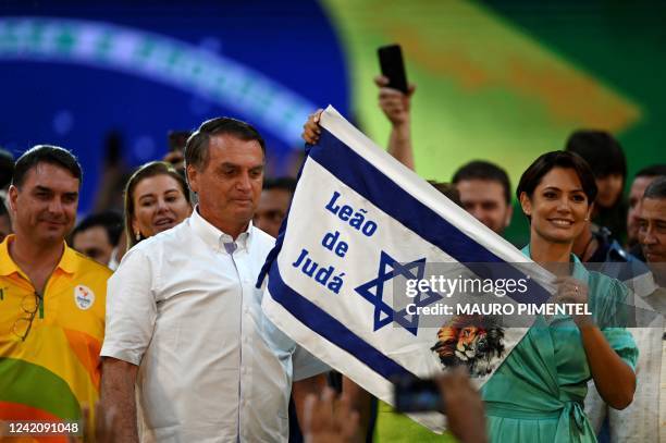 Brazil's President Jair Bolsonaro and his wife Michelle Bolsonaro attend the Liberal Party national convention where he was officially appointed as...