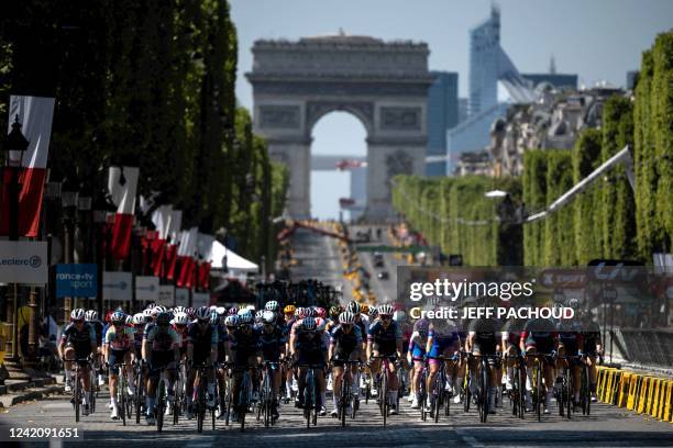 The pack rides on the Champs Elysees during the 1st stage of the new edition of the Women's Tour de France cycling race 6 km between the Tour Eiffel...