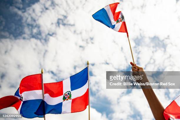 Fans display Dominican Republic flags during the induction ceremony for Hall of Fame Class of 2022 Inductee David Ortiz during the 2022 Hall of Fame...
