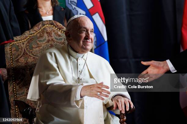 Pope Francis greets clergymen as he arrives in Canada, on July 24, 2022 in Edmonton, Canada. Pope Francis is touring Canada to meet with Indigenous...