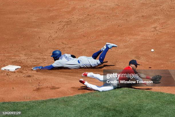 George Springer of the Toronto Blue Jays safely steals second base as the throw gets by Yolmer Sanchez of the Boston Red Sox during the second inning...