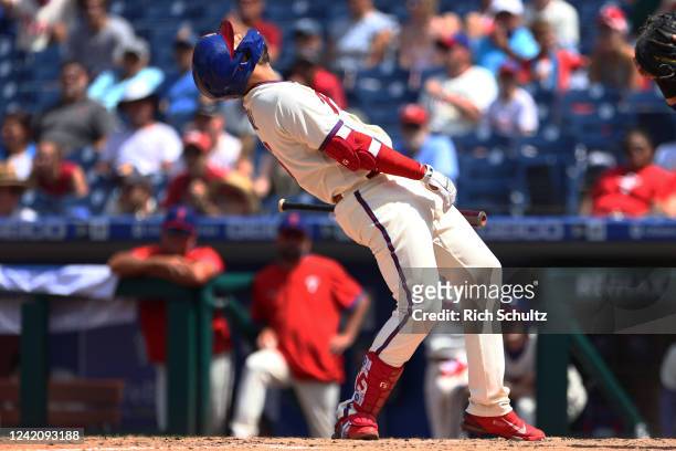 Darick Hall of the Philadelphia Phillies reacts to a called third strike during the eighth inning of a game against the Chicago Cubs at Citizens Bank...
