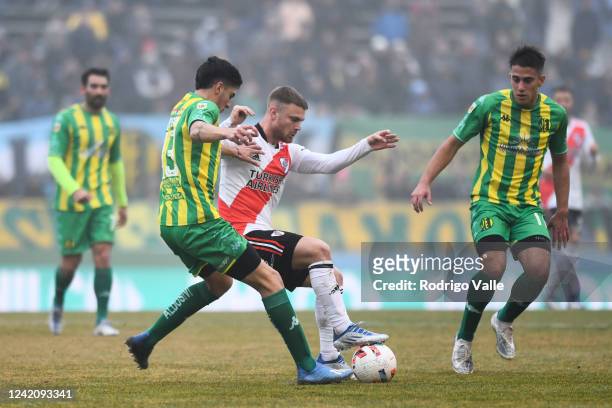 Lucas Beltran of River Plate fights for the ball with Leandro Maciel of Aldosivi during a match between Aldosivi and River Plate as part of Liga...