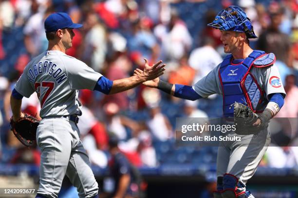 Closer David Robertson of the Chicago Cubs shakes hands with catcher Yan Gomes after defeating the Philadelphia Phillies 4-3 in a game at Citizens...