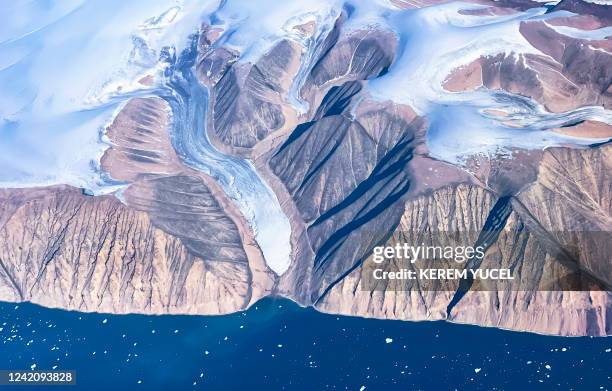 An aerial view of icebergs and ice sheet near Pituffik, Greenland on July 19, 2022 as captured on a NASA Gulfstream V plane while on an airborne...
