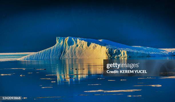 An iceberg floats in the Baffin Bay near Pituffik, Greenland on July 15, 2022 as captured on a NASA Gulfstream V plane while on an airborne mission...