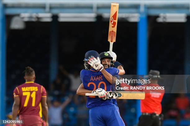 Axar Patel and Mohammed Siraj of India celebrate winning the 2nd ODI match between West Indies and India at Queens Park Oval, Port of Spain, Trinidad...