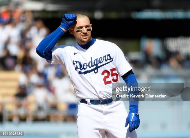 Trayce Thompson of the Los Angeles Dodgers gestures after his RBI double against relief pitcher Tyler Rogers of the San Francisco Giants in the...