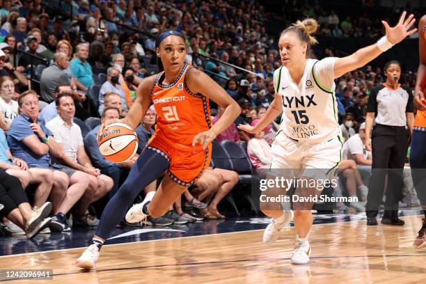 DiJonai Carrington of the Connecticut Sun dribbles the ball during the game against the Minnesota Lynx on July 24, 2022 at the Target Center in...