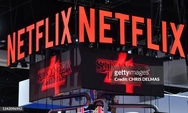 The Netflix booth advertises "Stranger Things" Season 4 on a screen during Comic-Con International in San Diego, California, on July 24, 2022.