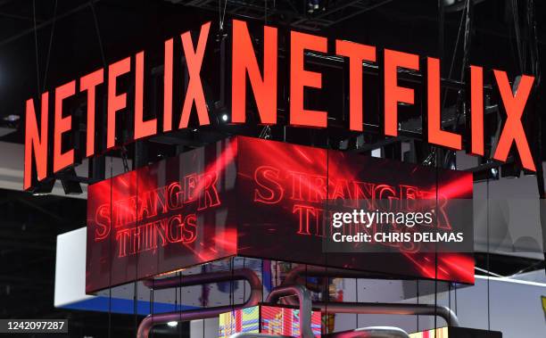 The Netflix booth advertises "Stranger Things" Season 4 on a screen during Comic-Con International in San Diego, California, on July 24, 2022.