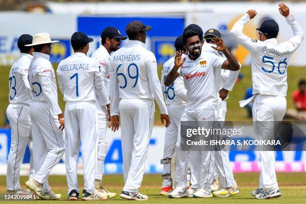 Sri Lanka's players celebrate after the dismissal of Pakistan's Abdullah Shafique during the second day of the second cricket Test match between Sri...