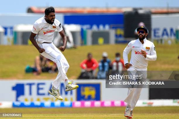 Sri Lanka's Prabath Jayasuriya celebrates after taking the wicket of Pakistan's captain Babar Azam during the second day of the second cricket Test...