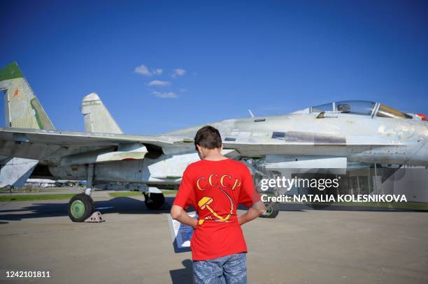 Boy wearing a red t-shirt reading USSR with a hammer and sickle symbol tours Patriot Park, a sort of military Disneyland outside Moscow aimed at...