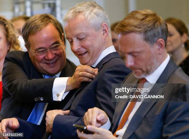 German Finance Minister Christian Lindner, France's Finance Minister Bruno Le Maire and the former leader of Germany's Christian Democratic Union...