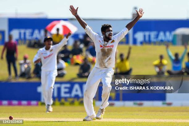 Sri Lanka's Ramesh Mendis celebrates after taking the wicket of Pakistan's Fawad Alam during the second day of the second cricket Test match between...