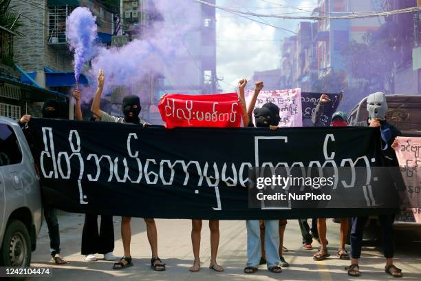 Young demonstrators hold a large banner reading &quot;We Will Never Be Frightened&quot; during an anti-coup protest in Yangon, Myanmar on July 25,...