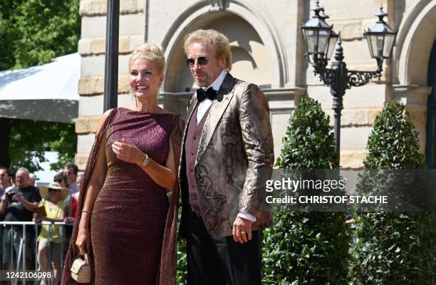 German TV host Thomas Gottschalk and his partner Karina Mross arrive for the opening of the annual Bayreuth Festival featuring the music of German...