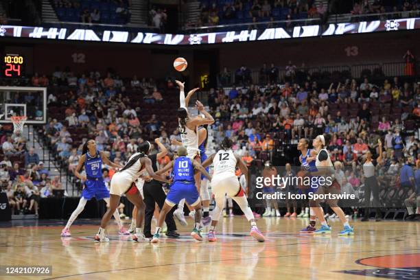 Las Vegas Aces forward A'ja Wilson reaches for the ball during the opening tip off against Connecticut Sun forward Brionna Jones during the WNBA game...