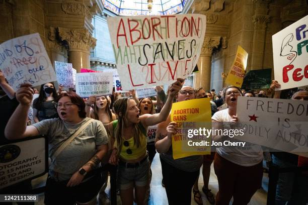 Abortion rights protesters shout into the Senate chamber in the Indiana State Capitol building on July 25, 2022 in Indianapolis, Indiana. Activists...