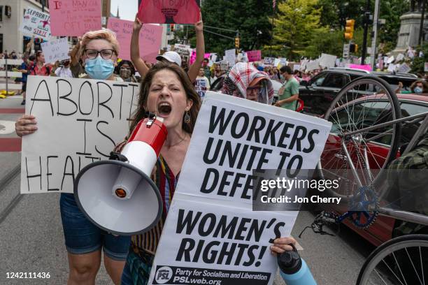 Abortion rights protesters march outside of Indiana State Capitol building on July 25, 2022 in Indianapolis, Indiana. Activists are gathering during...