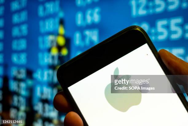 In this photo illustration, the American multinational technology company Apple logo is displayed on a smartphone screen.