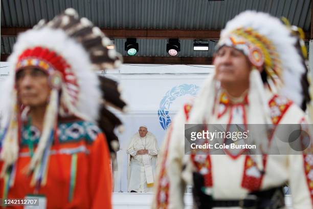 Pope Francis is seen on stage ahead of his apology for the treatment of First Nations children in Canada's Residential School system, during his...