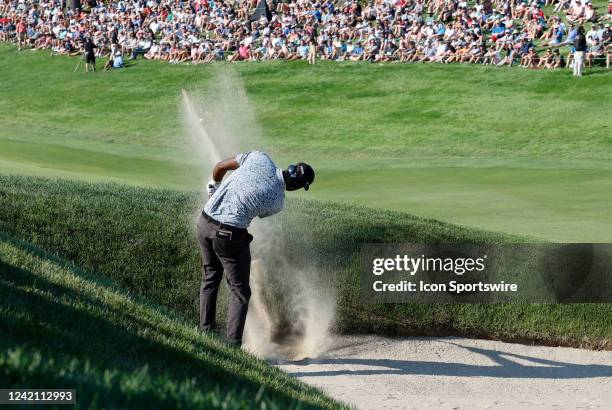 Sahith Theegala, of Woodlands, TX, hits his third shot out of the bunker on 18 during the Final Round of the Travelers Championship on June 26 at TPC...