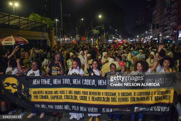 Demonstrators take part in the Black Women's March against gender violence on the International Day of the Afro-Latin American and Caribbean Women,...