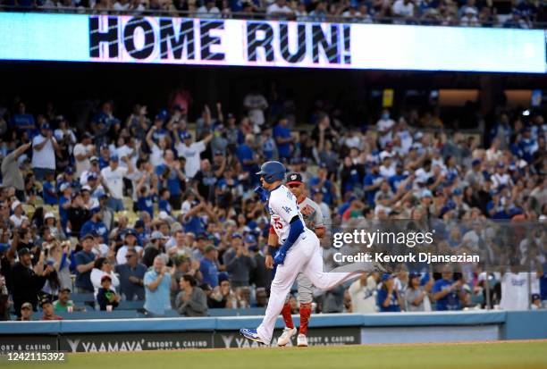 Trayce Thompson of the Los Angeles Dodgers celebrates as he runs the bases after hitting a one run home against starting pitcher Paolo Espino of the...