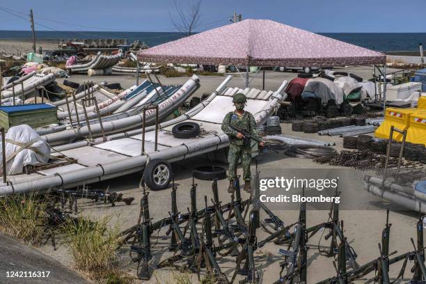 Soldier stands guard on a beach during a military exercise in Miaoli, Taiwan, on Tuesday, July 26, 2022. The dispute over Taiwan's sovereignty is the...